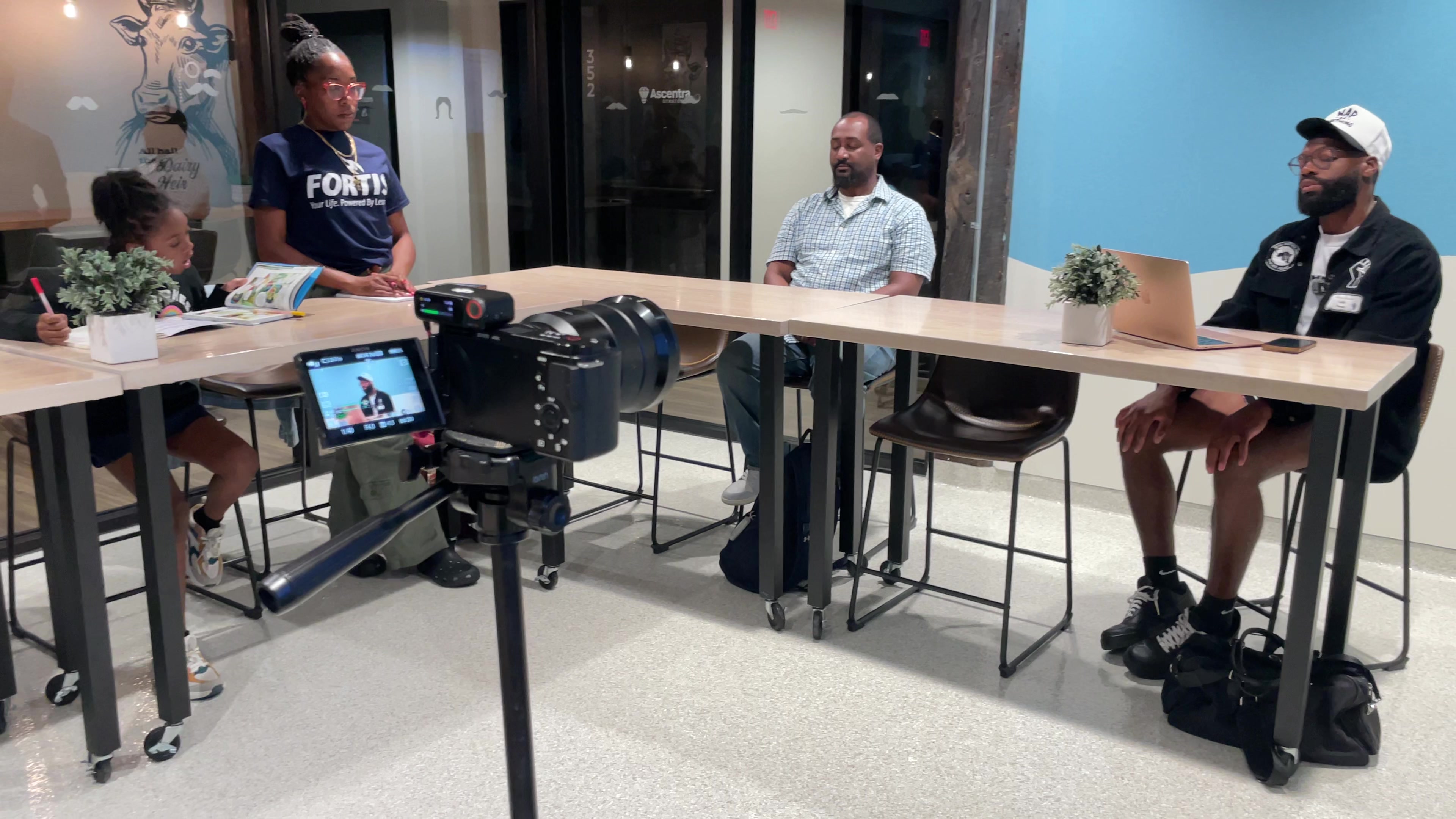 On set at the Murdock Hustlers Mastermind — multi-camera capture of a coaching session